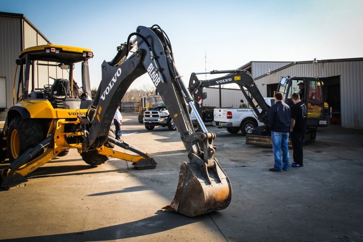 Two men in construction yard