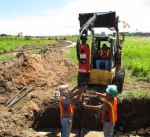 Ram Jack workers using machine