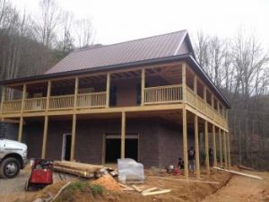 Large house in wooded area being built