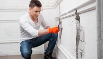 Technician repairing cracked stone