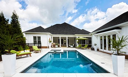 a properly installed and finished pool in a beautiful backyard setting