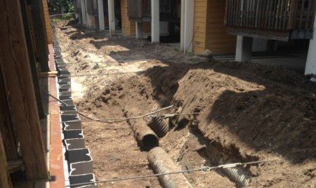 A seawall being reinforced with helical tie-back anchors.